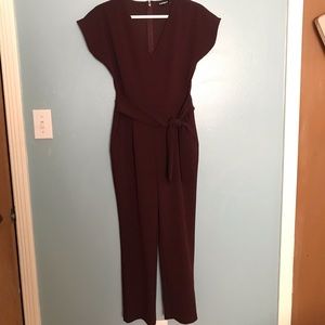 Express jumpsuit in burgundy.